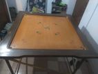 ৫৬ ইঞ্চি একটি ক্যারাম বোর্ড