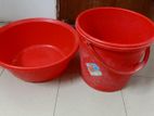 a red tub and bucket