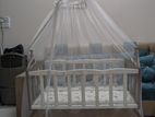 Baby wooden cot/swinging dolna with mosquito net and drawers