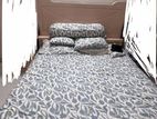 Bed and side table
