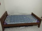 Bed with mattresses