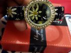Black and white Daisy adjustable watch.
