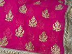bright magenta sari with golden paar