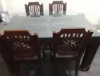 চারটি চেয়ার ও একটি ডাইনিং টেবিল কাচের ঢাকনাসহ বিক্রি হবে।