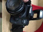 Canon eos 77d with 50mm prime is 2 ,18-55mm stm and flashlight setup