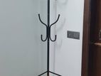 Coat stand with 2 shelves and 8 hooks.