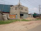 Commercial property sale with factory shade and office building.