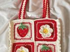 Crochet tote bag with zipper.