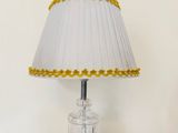 "Elegant Crystal Base Table Lamp with Pleated Shade and Golden Trim"