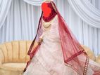 Elegant pinkinsh peach Bridal Lahenga with beautiful mirror art