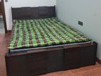 Exclusive double board bed with mattress.