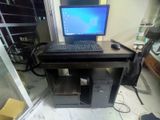 full computer with table and monitor