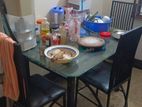 Good condition dinning table and 4 chair with glass