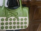 Green and white hand bag