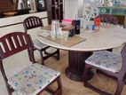 hatil table along with marble top and 4 dining chairs