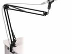 Microphone arm stand on a flexible boom scissor