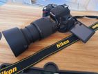 Nikon D5100 with 200mm VR Zoom lens/Mic port