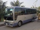 Nissan Coster Bus For Rent