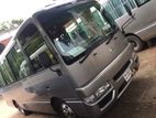 Nissan Coster Bus For Rent