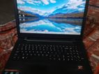 One Laptop With Adopter