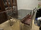 Steel Dining table with Glass Top and Four Chairs