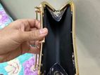 “Stylish Blue Floral Clutch Bag with Golden Handle - Elegant & Chic”