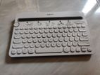 white Logitech keyboard