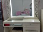 white vanity table with lights